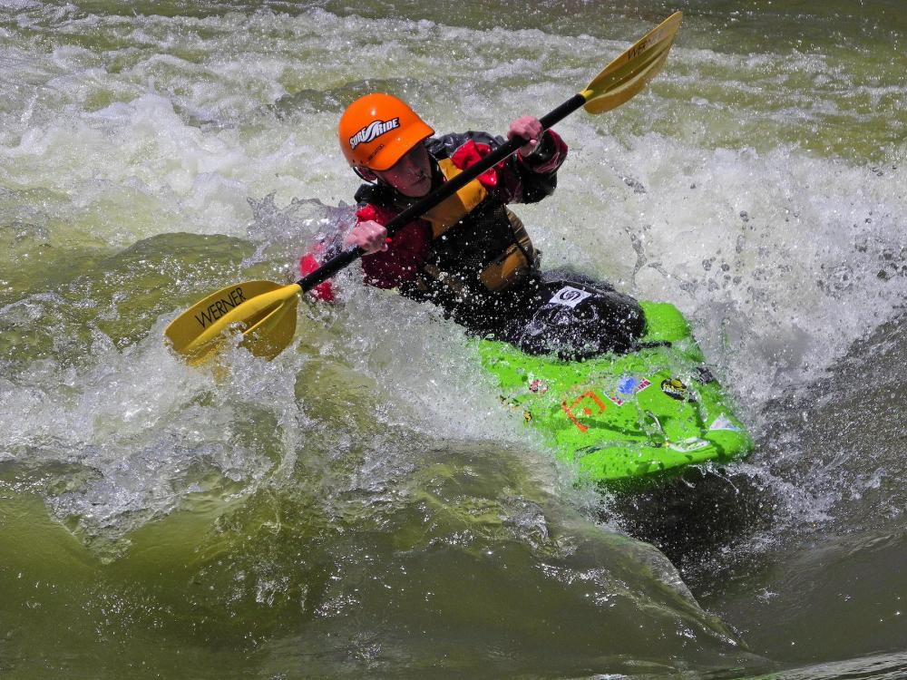 A whitewater kayaker paddles through the Rio Grande River