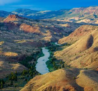 River winding through a valley in a mountainous high desert landscape 