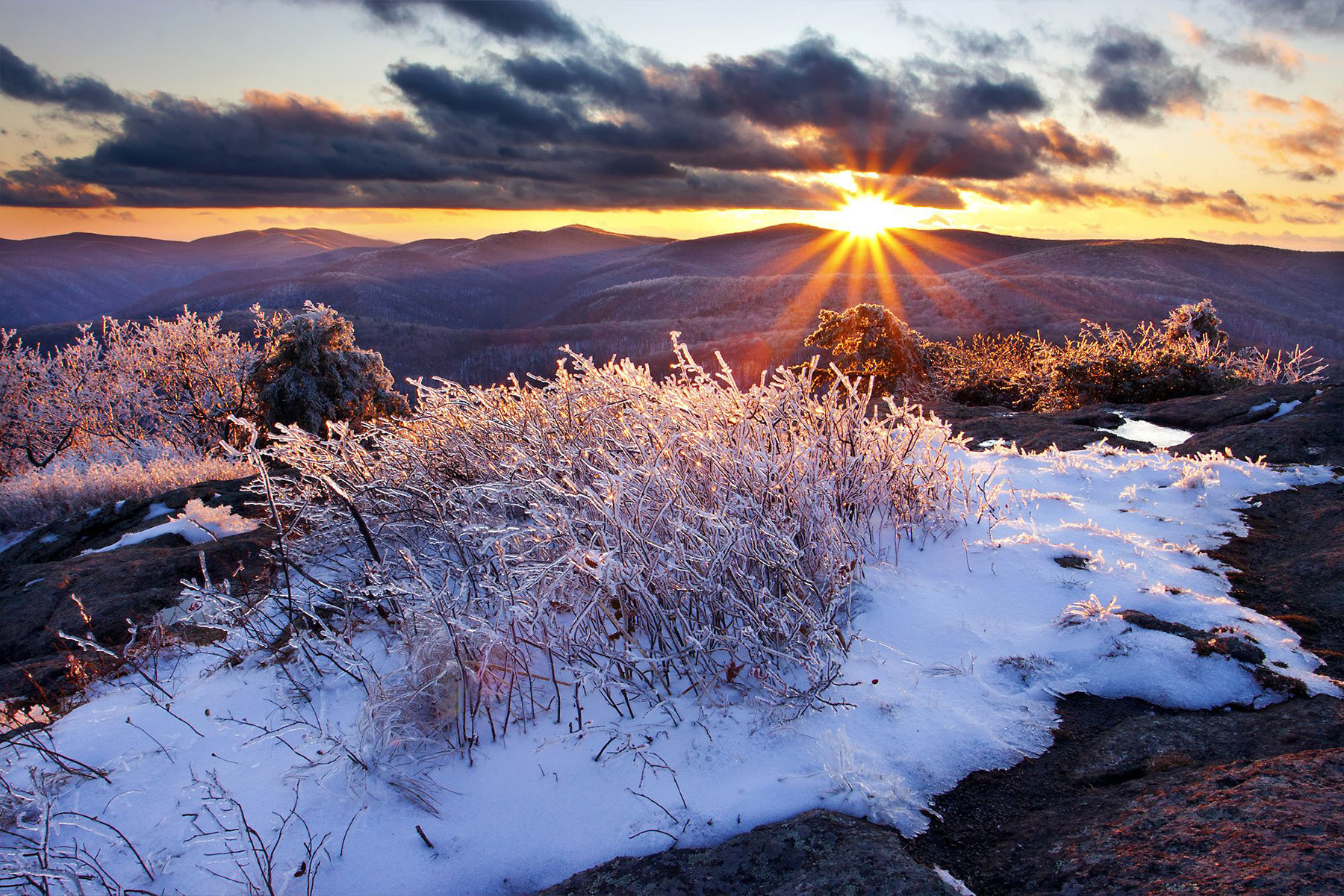 snow patch with mountains in the background