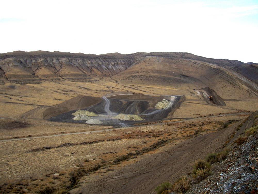 Bowl-shaped ditch at open-pit mineral mining site in Hot Springs County, Wyoming