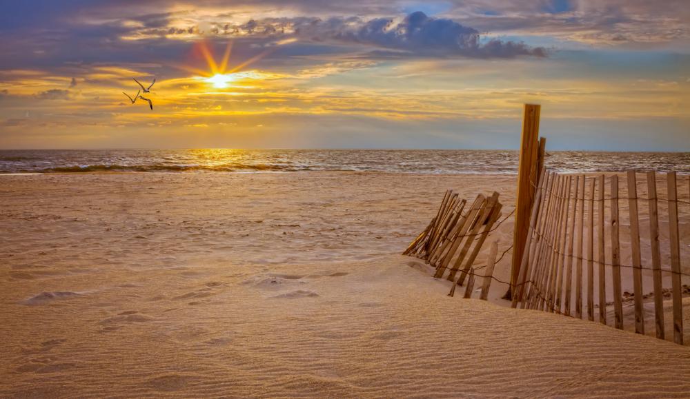 Many enjoy the sunsets and soft sands of the barrier island.