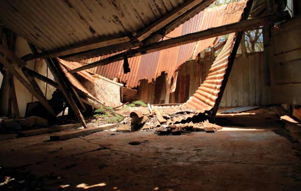 Collapsed, rusted roof inside abandoned building in former Honouliuli Internment Camp, Hawaii
