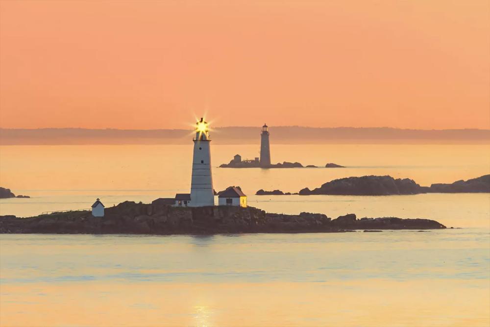 Boston Light (foreground) and Graves Light (background) at sunset.