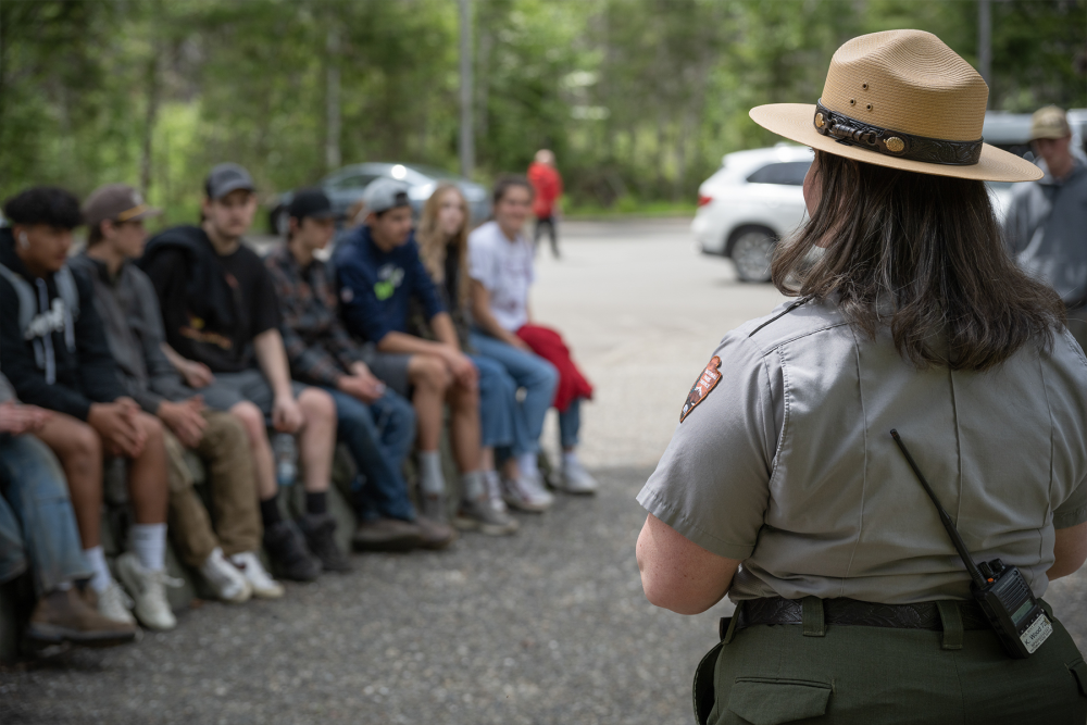 park ranger talking to a group of young people