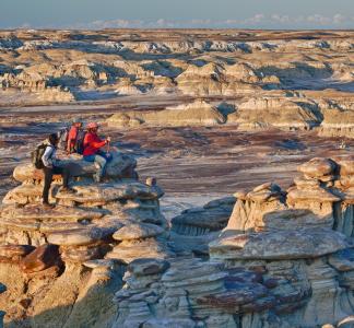 Hikers look out out into the distance at the Ah-shi-sle-pah wilderness